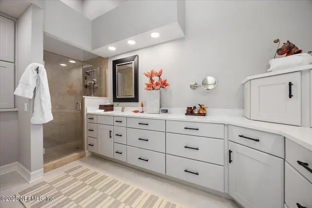 a bathroom with a double vanity sink mirror and