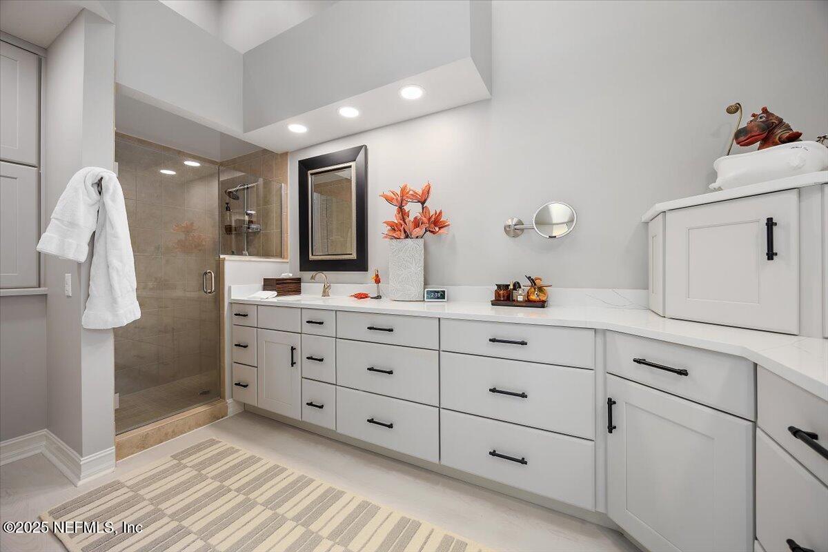 174 Laterra Links Circle, Unit 201 St. Augustine, FL 32092 - Photo 22 of 41 a bathroom with a double vanity sink mirror and