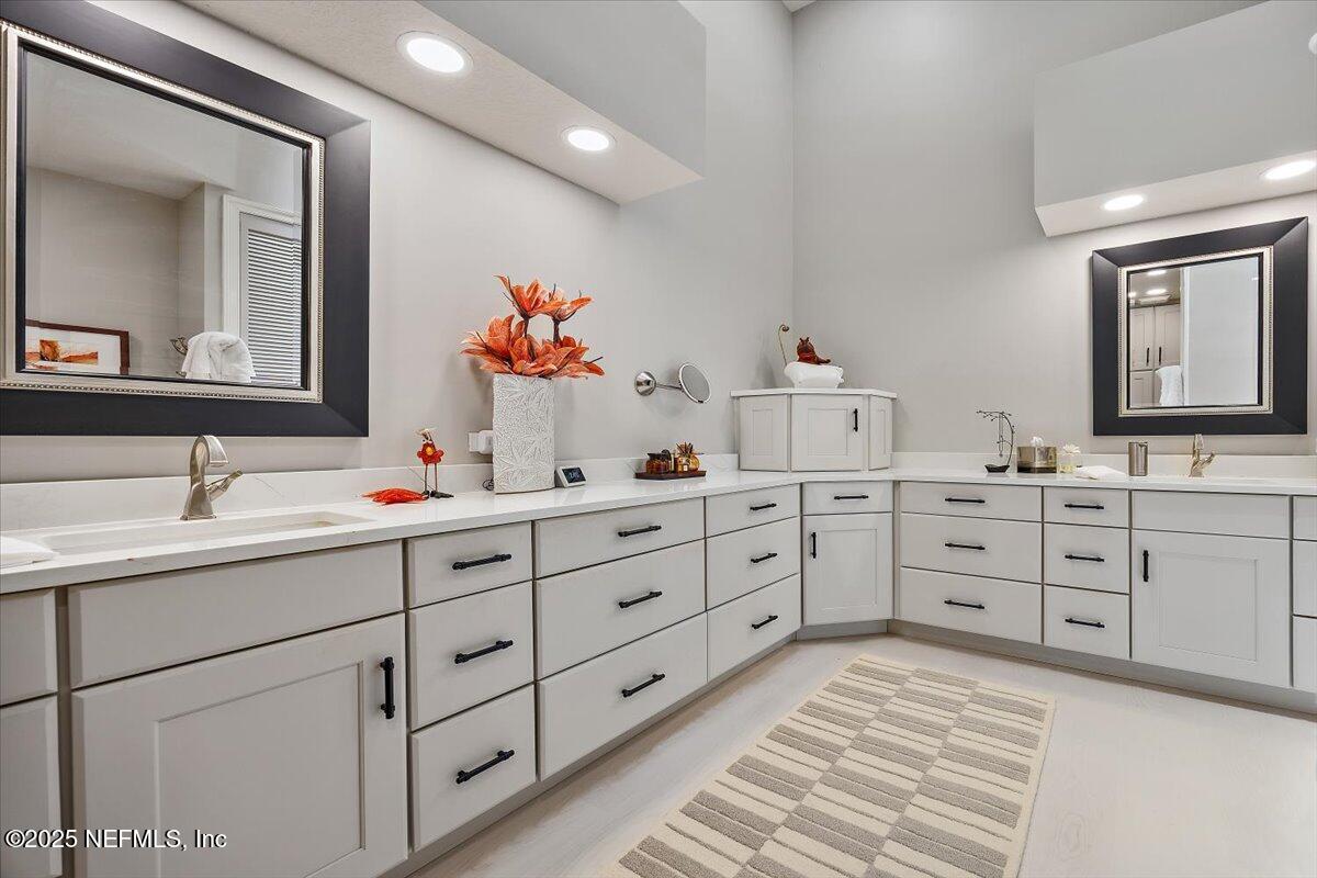 174 Laterra Links Circle, Unit 201 St. Augustine, FL 32092 - Photo 23 of 41 a bathroom with a double vanity sink mirror and