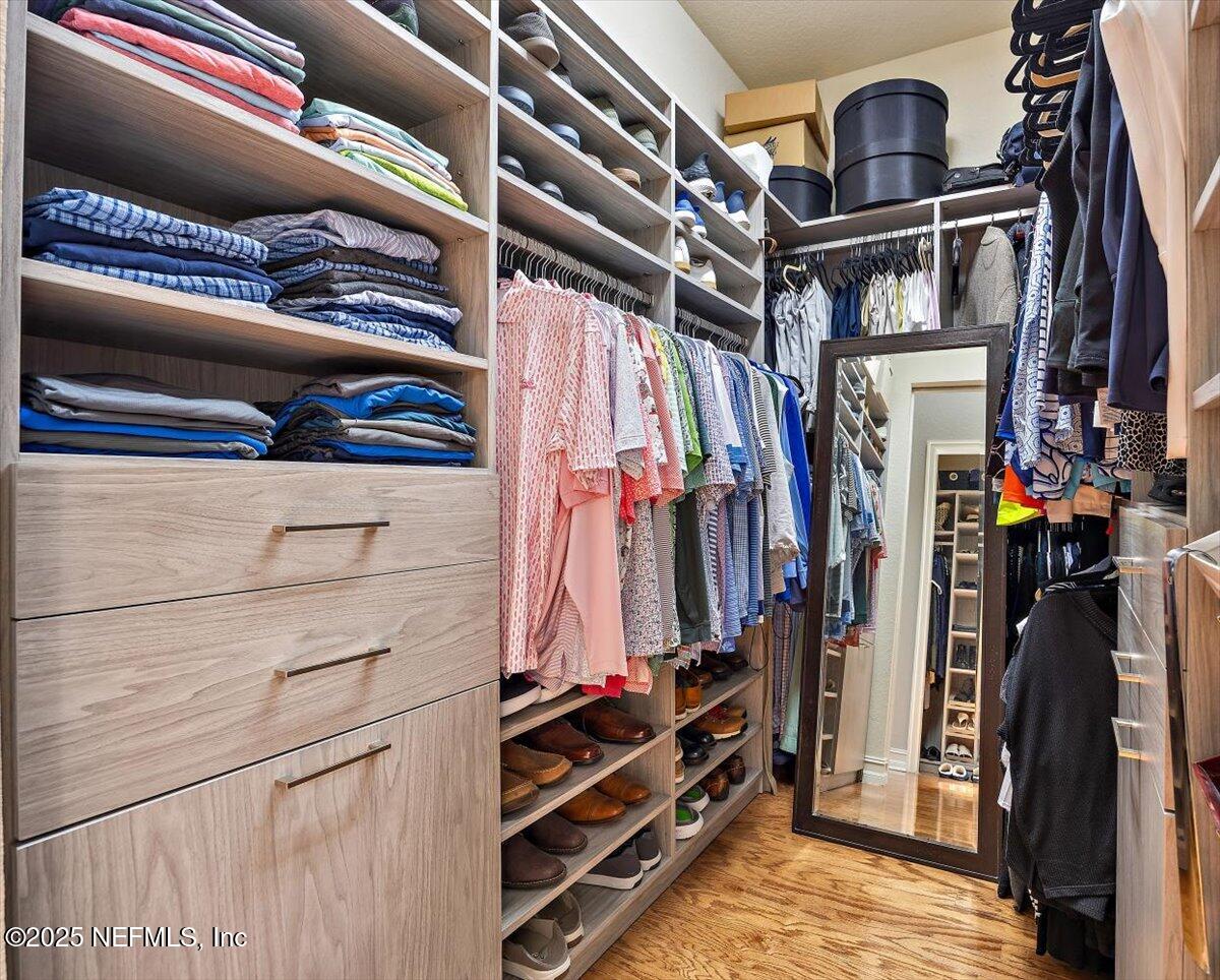 174 Laterra Links Circle, Unit 201 St. Augustine, FL 32092 - Photo 24 of 41 a view of walk in closet with clothes and shoes