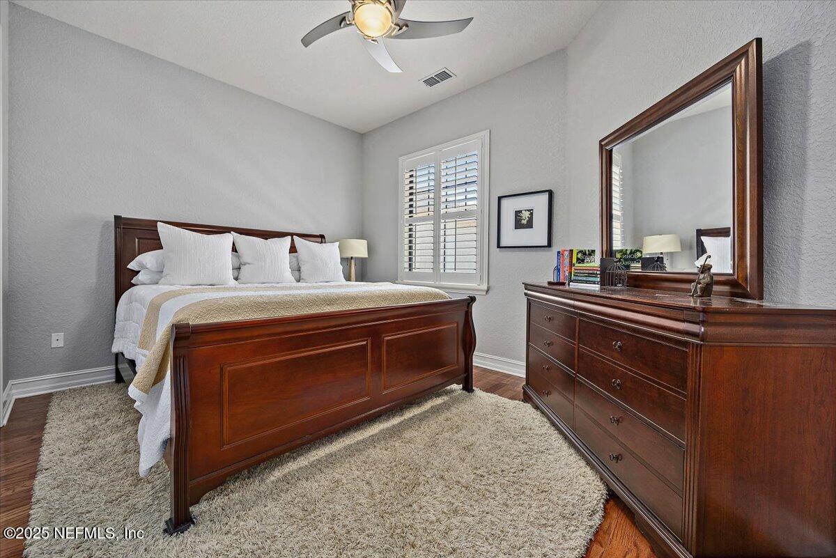 174 Laterra Links Circle, Unit 201 St. Augustine, FL 32092 - Photo 25 of 41 a bedroom with a bed and a dresser