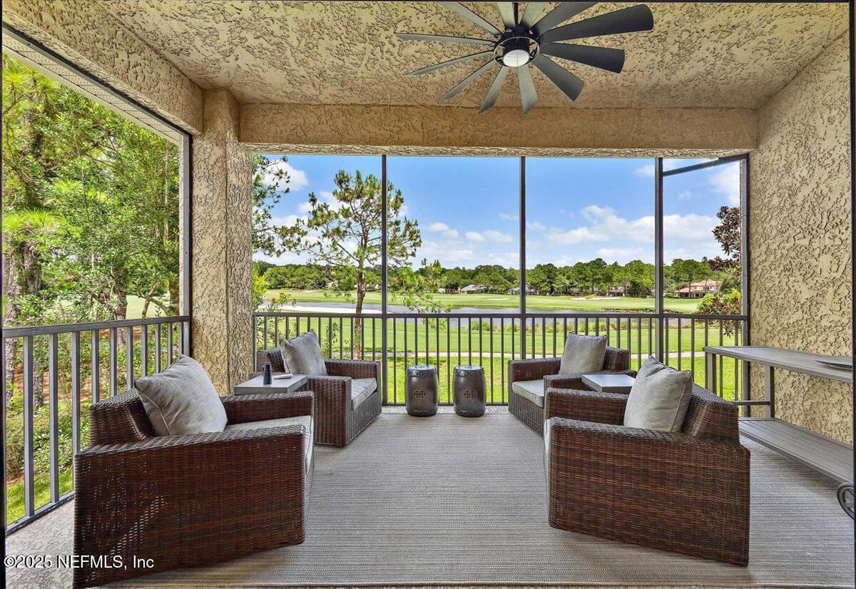 174 Laterra Links Circle, Unit 201 St. Augustine, FL 32092 - Photo 31 of 41 a living room with furniture and a large window