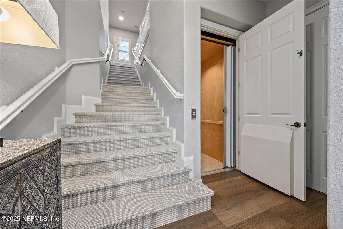174 Laterra Links Circle, Unit 201 St. Augustine, FL 32092 - Photo 6 of 41 a view of entryway and hall with wooden floor