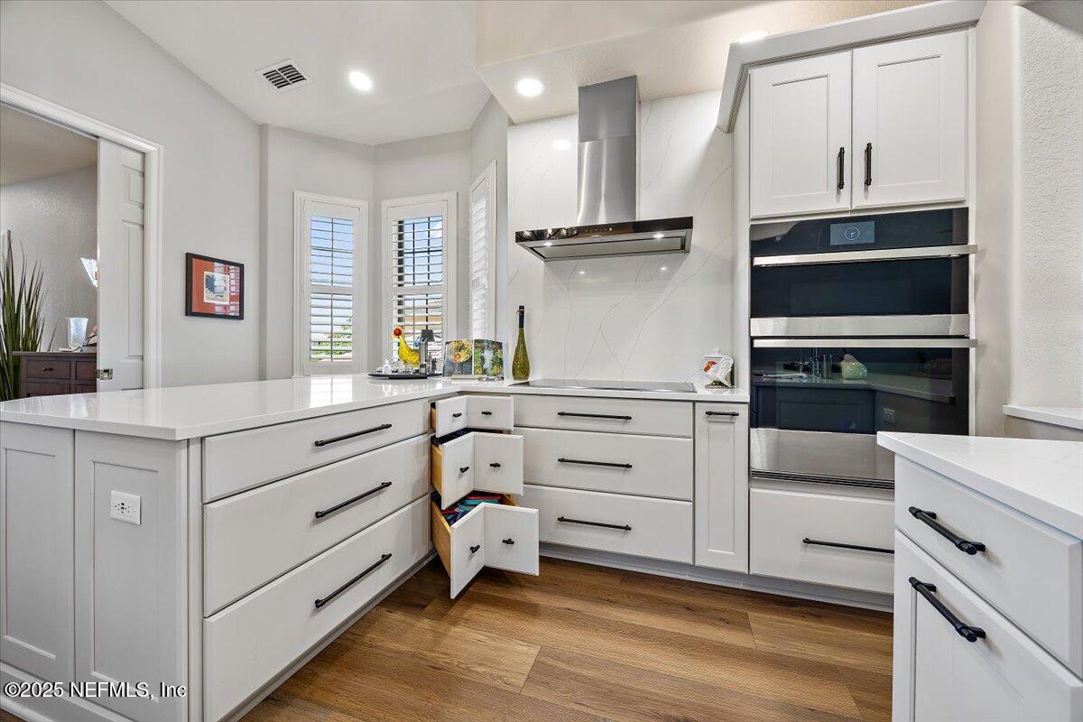 174 Laterra Links Circle, Unit 201 St. Augustine, FL 32092 - Photo 10 of 41 a kitchen with white cabinets and window