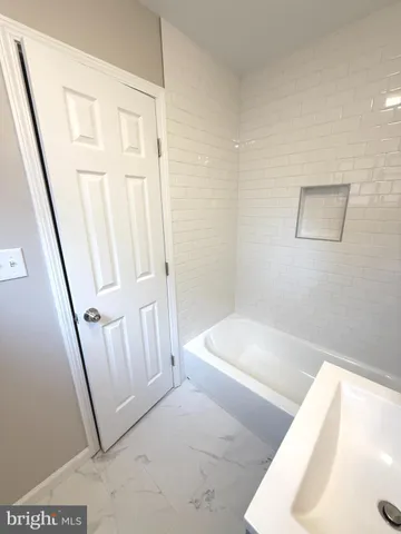 a view of a hallway with staircase