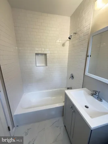 a bathroom with a sink and a bathtub