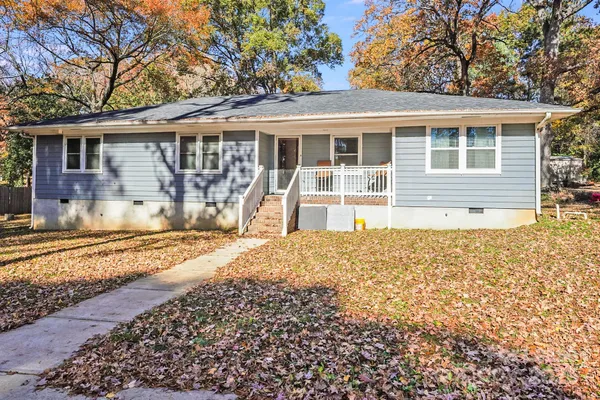 front view of a house with a yard