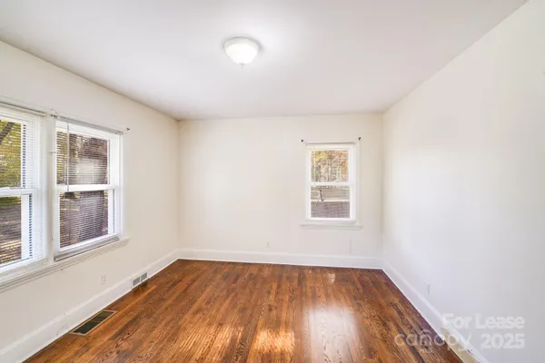 a bathroom with a bathtub shower sink vanity and toilet