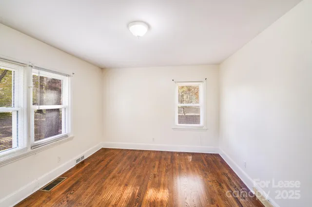 a bathroom with a bathtub shower sink vanity and toilet