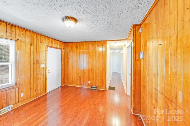 a view of an entryway with wooden floor