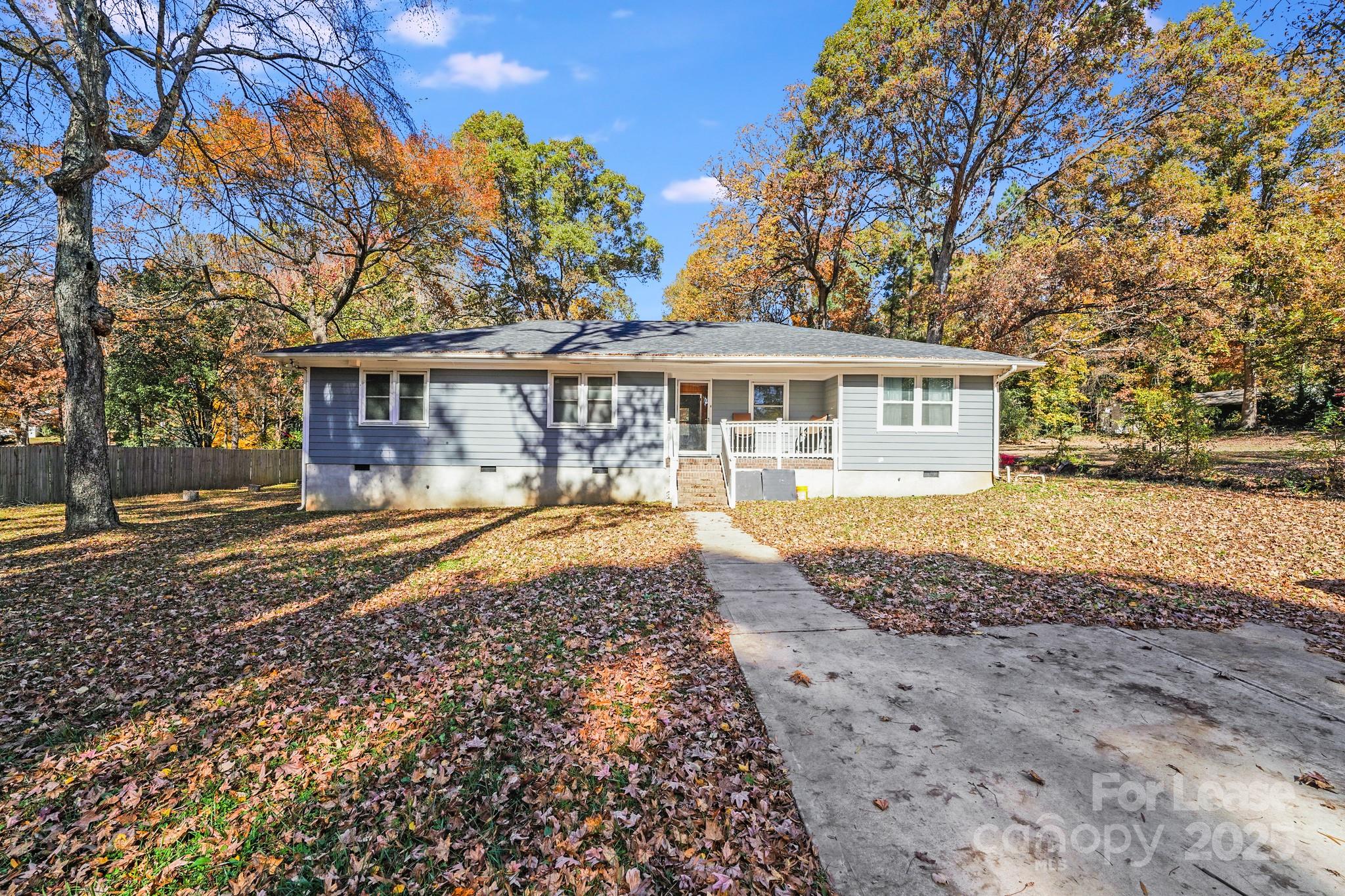 5311 Princess Street Charlotte, NC 28269 - Photo 21 of 24 a view of a house with a yard and sitting area