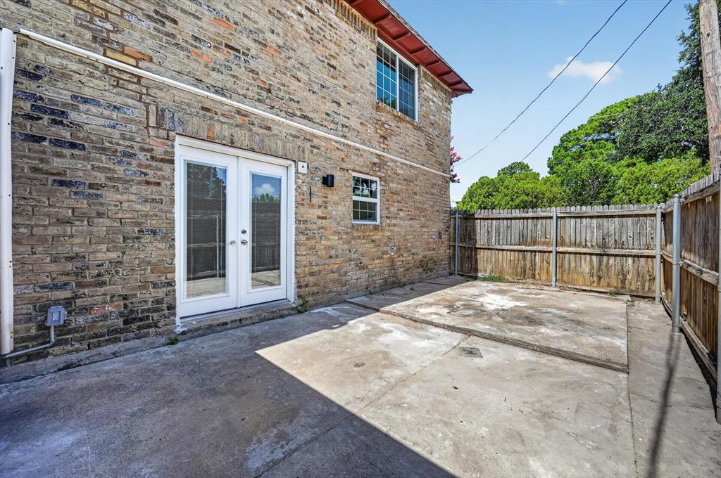 1801 East Grauwyler Road, Unit 101 Irving, TX 75061 - Photo 39 of 39 a view of a white house with large windows