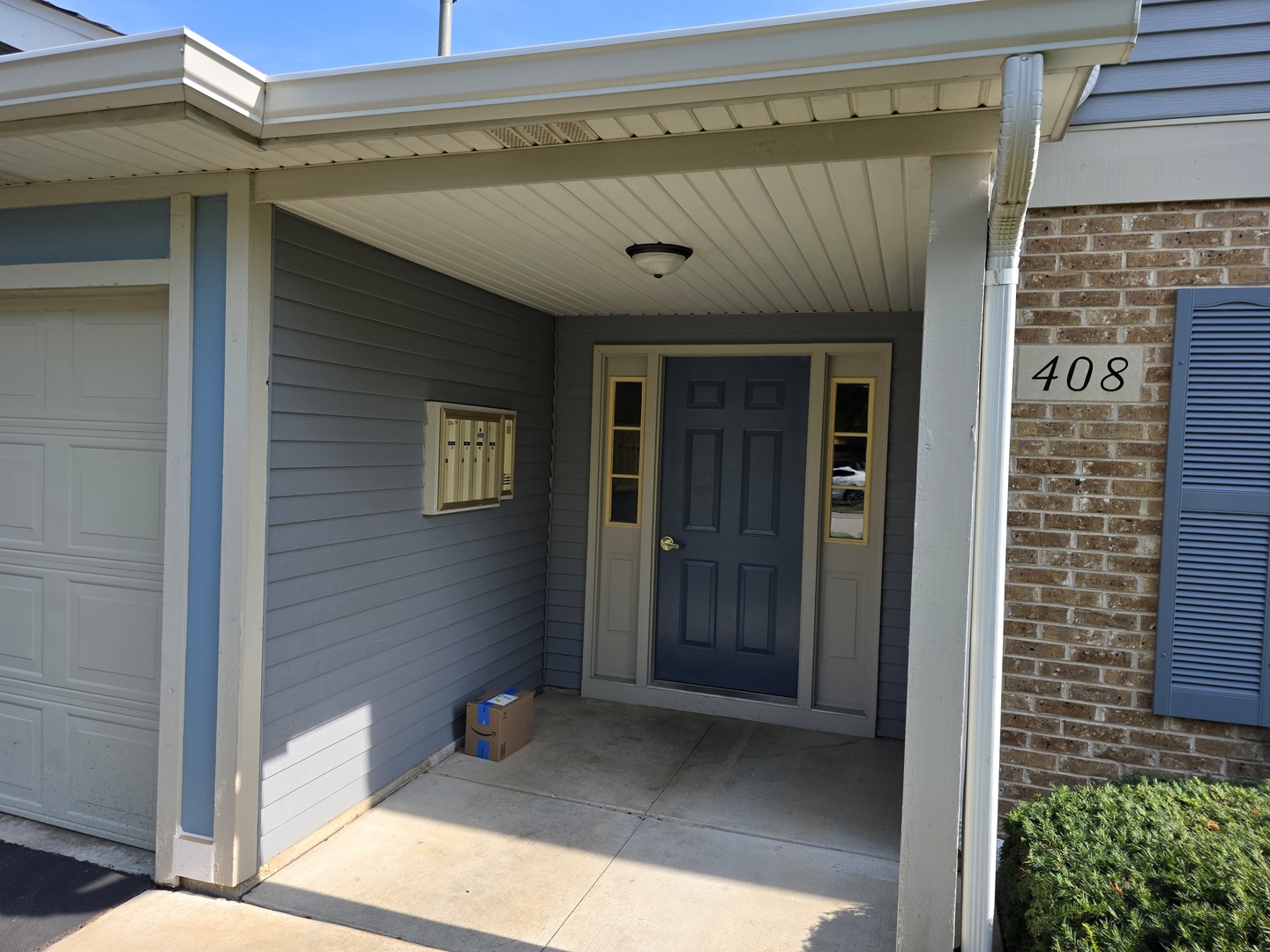 408 Woodview Circle, Unit B Elgin, IL 60120 - Photo 2 of 26 a view of entryway door of the house