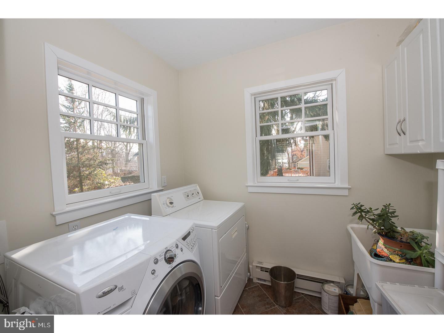 101 Glynn Lane Wayne, PA 19087 - Photo 12 of 25 a bathroom with a sink a window and a mirror