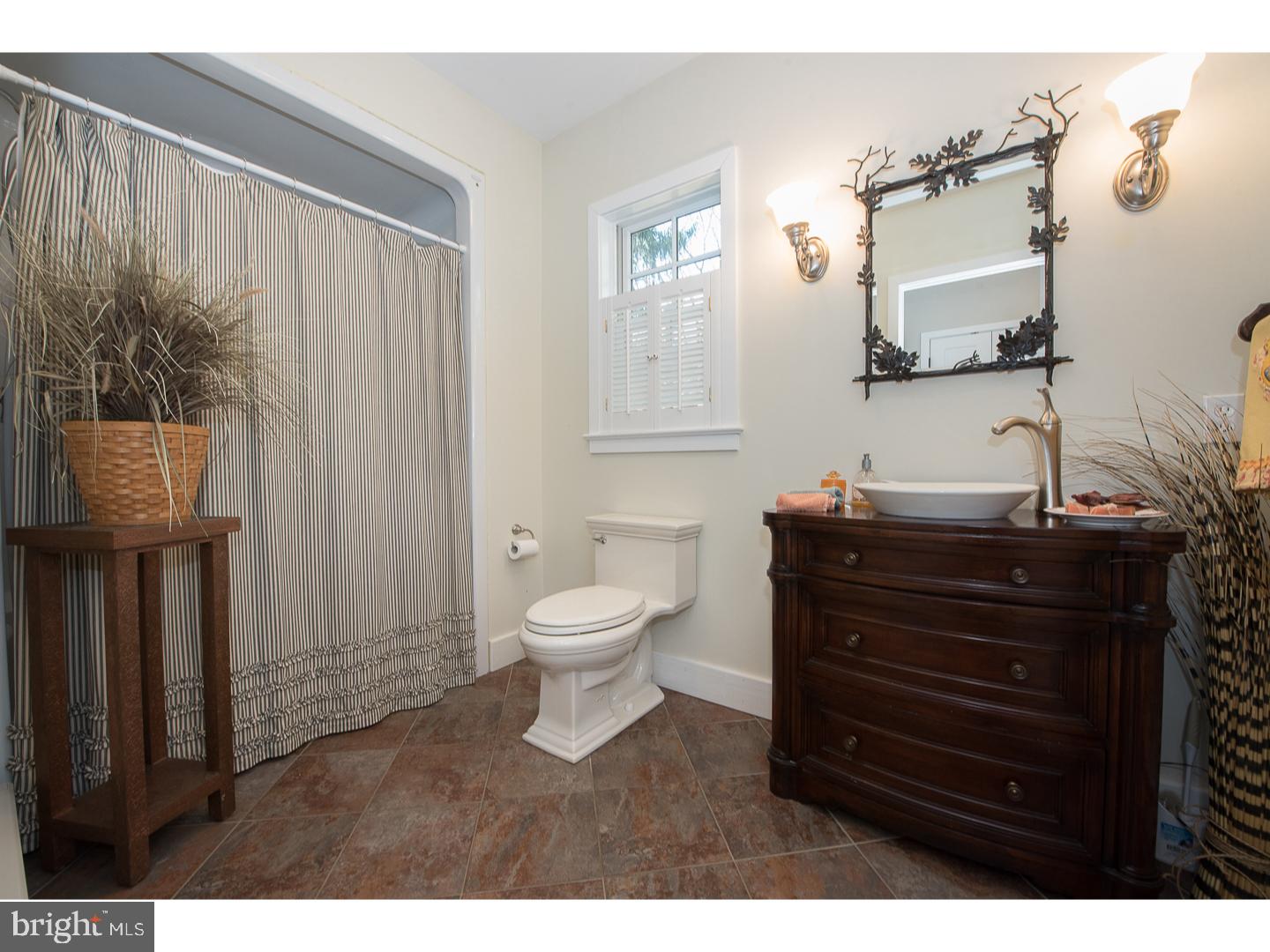 101 Glynn Lane Wayne, PA 19087 - Photo 13 of 25 a bathroom with a toilet a sink and mirror