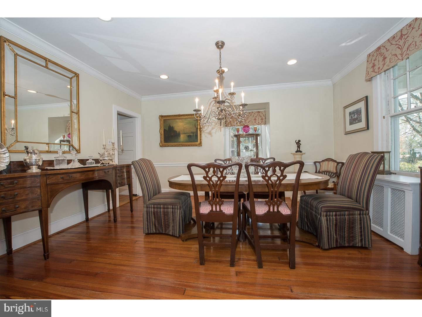 101 Glynn Lane Wayne, PA 19087 - Photo 14 of 25 a view of a dining room with furniture wooden floor and chandelier