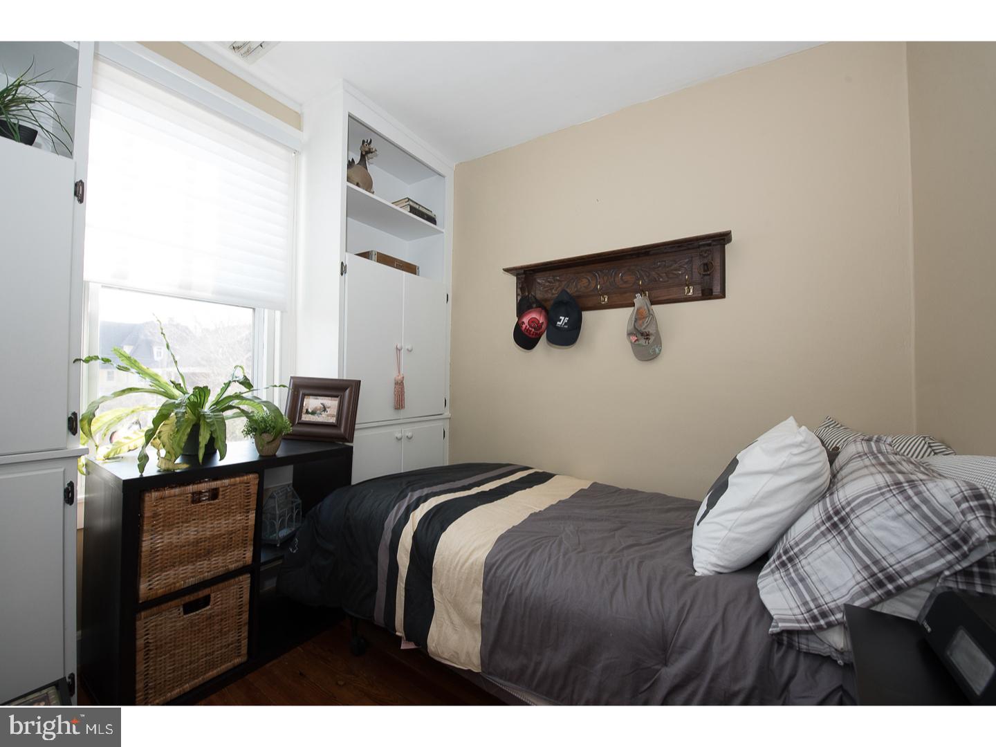 101 Glynn Lane Wayne, PA 19087 - Photo 16 of 25 a bedroom with a bed and a painting on the wall