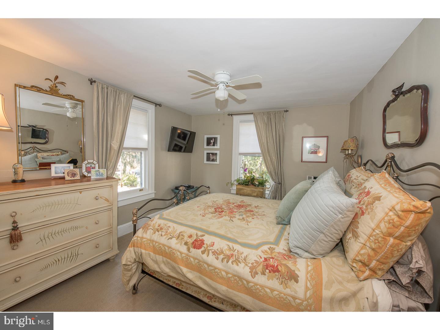 101 Glynn Lane Wayne, PA 19087 - Photo 18 of 25 a bedroom with a bed and a dresser