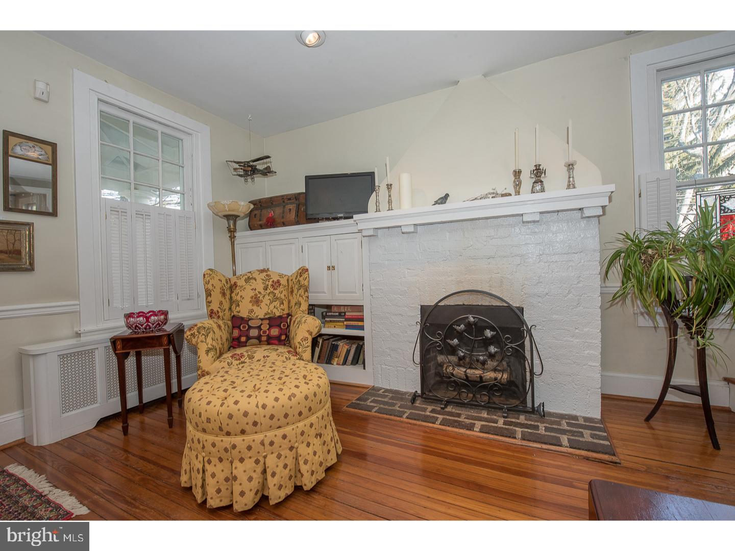 101 Glynn Lane Wayne, PA 19087 - Photo 4 of 25 a living room with furniture and a fireplace