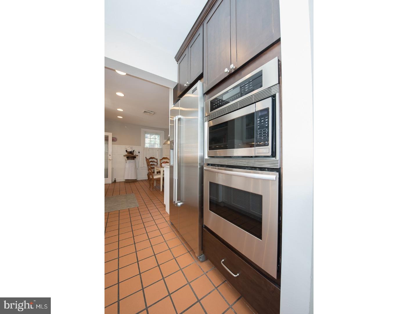 101 Glynn Lane Wayne, PA 19087 - Photo 10 of 25 a kitchen with stainless steel appliances a stove and a microwave