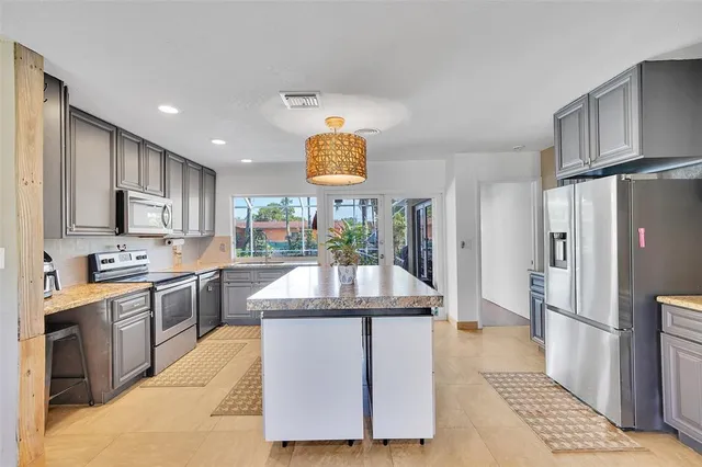 a view of living room with furniture and floor to ceiling window