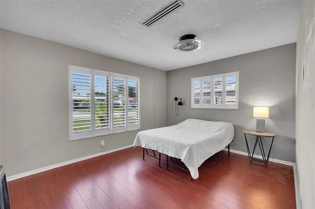 a sign broad in front of a brick building