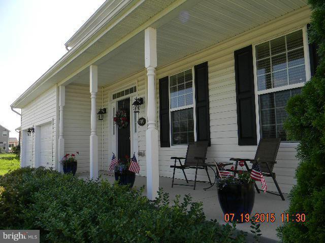 1702 Conrads Ferry Drive Point of Rocks, MD 21777 - Photo 2 of 29 a table and chairs in front of a house