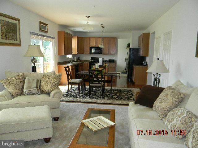 1702 Conrads Ferry Drive Point of Rocks, MD 21777 - Photo 13 of 29 a living room with furniture and kitchen view