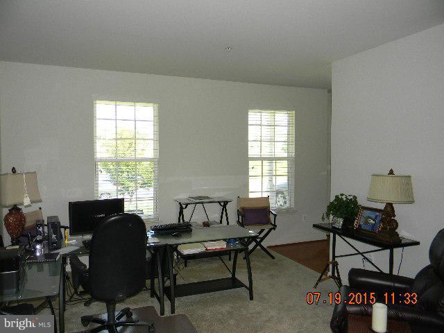 1702 Conrads Ferry Drive Point of Rocks, MD 21777 - Photo 4 of 29 a view of a livingroom and a dining room with wooden floor and a window