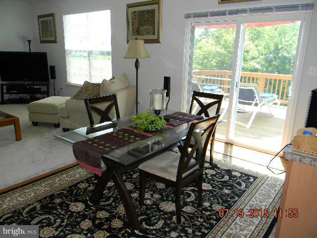 1702 Conrads Ferry Drive Point of Rocks, MD 21777 - Photo 9 of 29 a living room with furniture and a flat screen tv