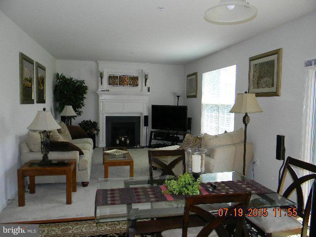 1702 Conrads Ferry Drive Point of Rocks, MD 21777 - Photo 10 of 29 a living room with furniture a flat screen tv and a fireplace