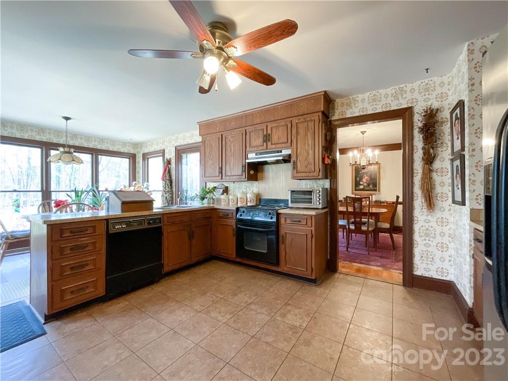 9523 Marvin School Road Marvin, NC 28173 - Photo 13 of 47 a large kitchen with a large counter top and stainless steel appliances