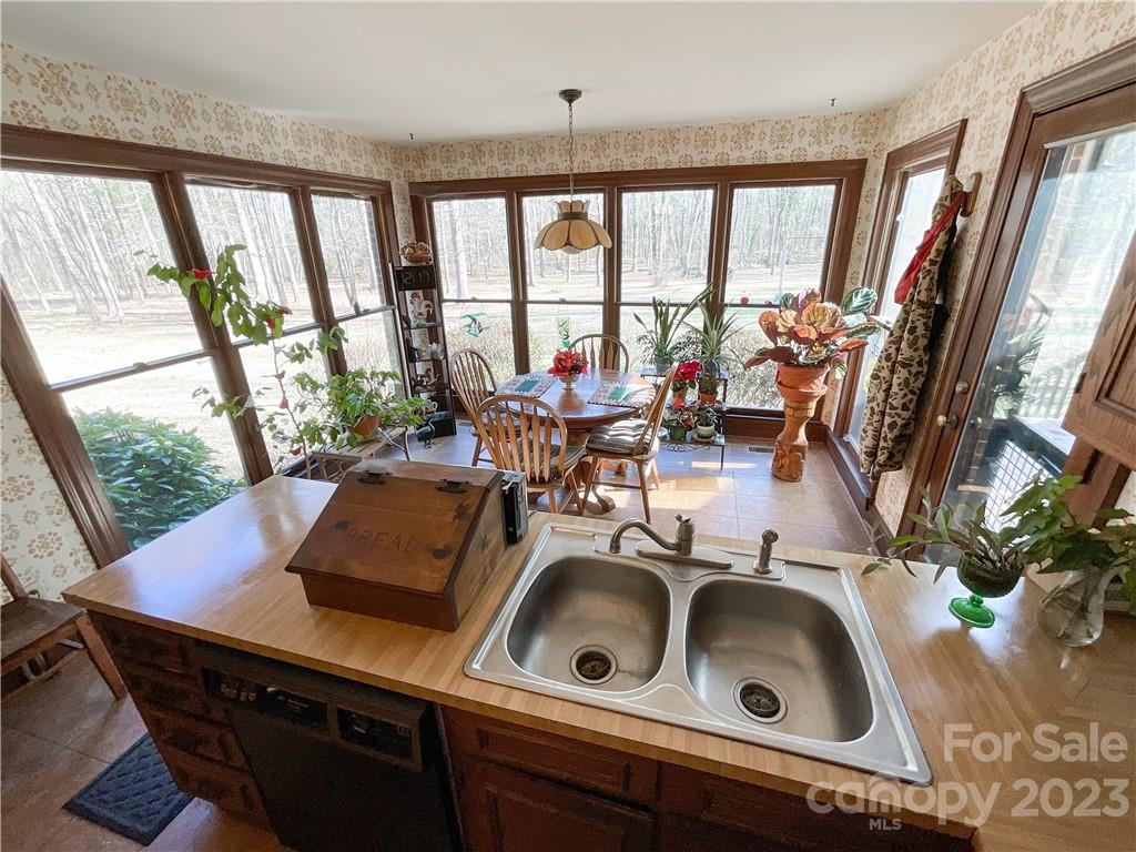 9523 Marvin School Road Marvin, NC 28173 - Photo 15 of 47 a view of a living room with furniture and floor to ceiling windows