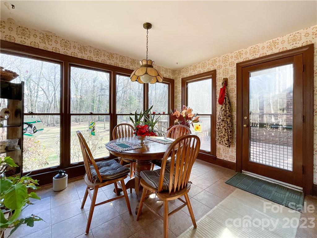 9523 Marvin School Road Marvin, NC 28173 - Photo 16 of 47 a view of a dining room with furniture window and outside view