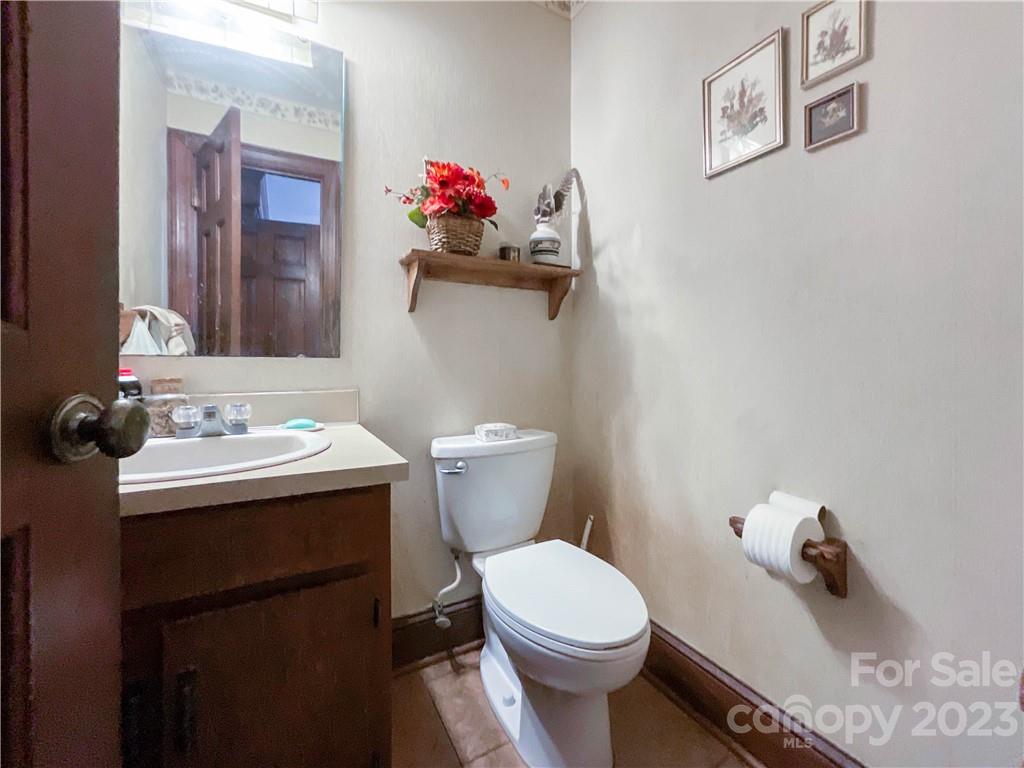 9523 Marvin School Road Marvin, NC 28173 - Photo 18 of 47 a bathroom with a sink mirror and toilet