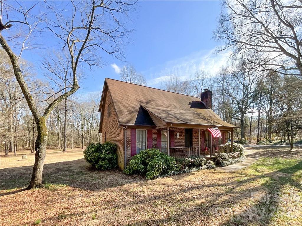 9523 Marvin School Road Marvin, NC 28173 - Photo 2 of 47 a front view of a house with a yard