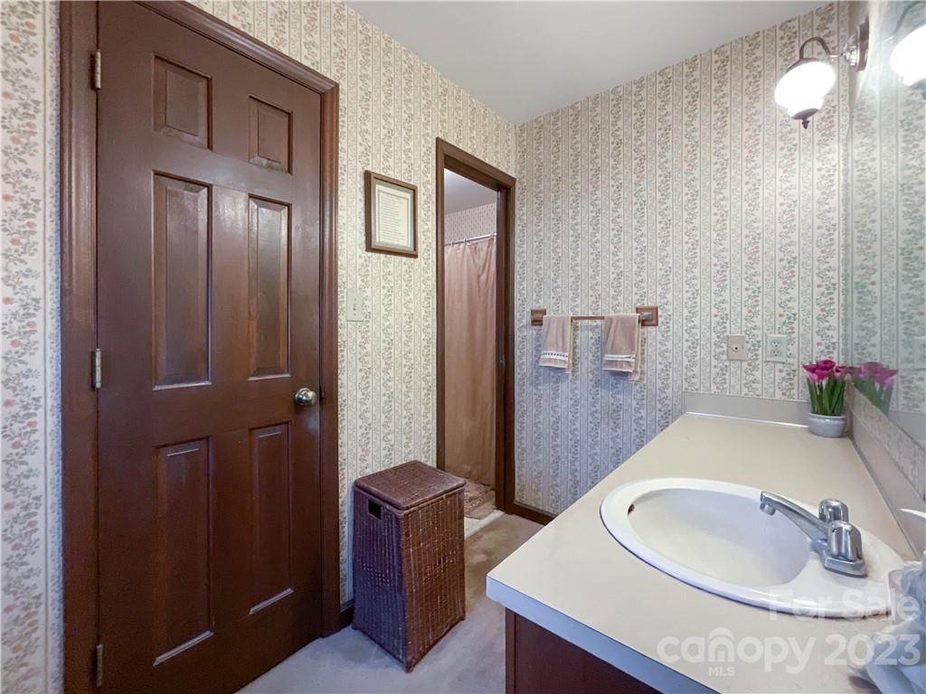 9523 Marvin School Road Marvin, NC 28173 - Photo 23 of 47 a bathroom with a sink a toilet and shower