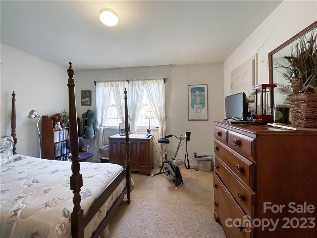 9523 Marvin School Road Marvin, NC 28173 - Photo 27 of 47 a bed room with a bed and a television