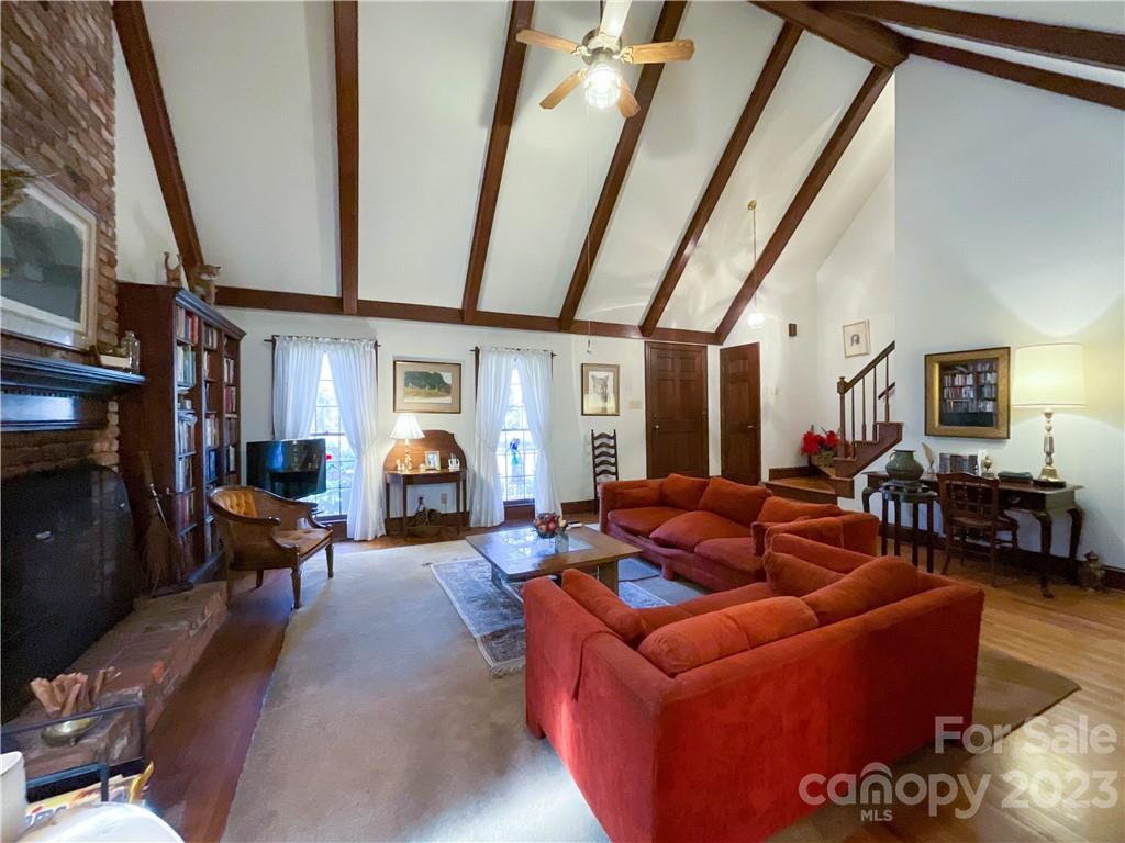 9523 Marvin School Road Marvin, NC 28173 - Photo 7 of 47 a living room with furniture a fireplace and wooden floor