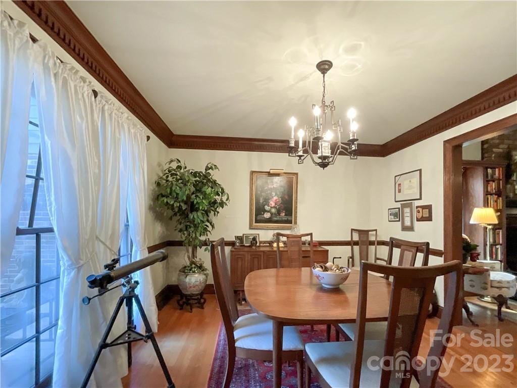 9523 Marvin School Road Marvin, NC 28173 - Photo 9 of 47 a view of a dining room with furniture and a chandelier