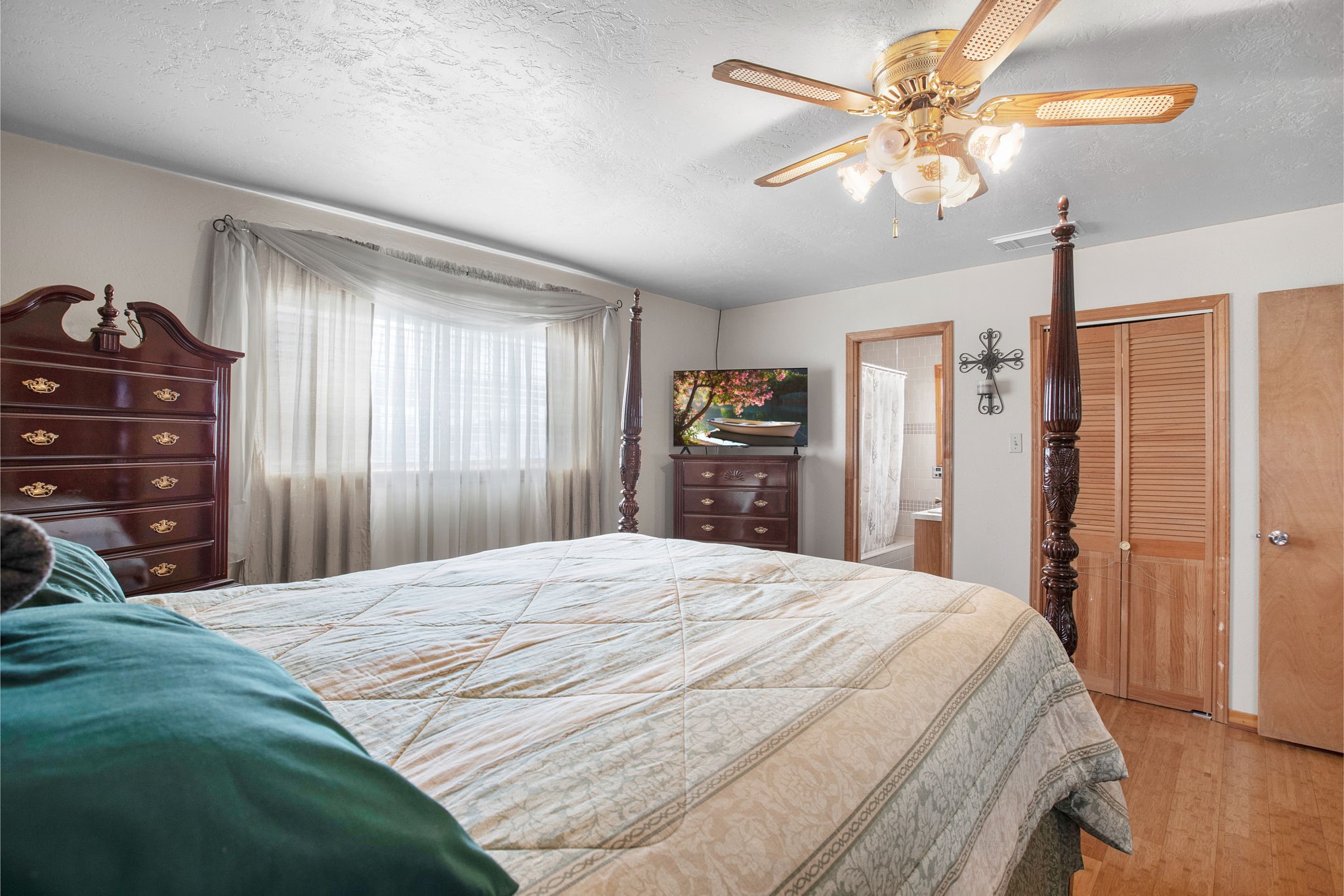 14205 Bohemian Hall Road Crosby, TX 77532 - Photo 11 of 33 a bedroom with a bed dresser and a window