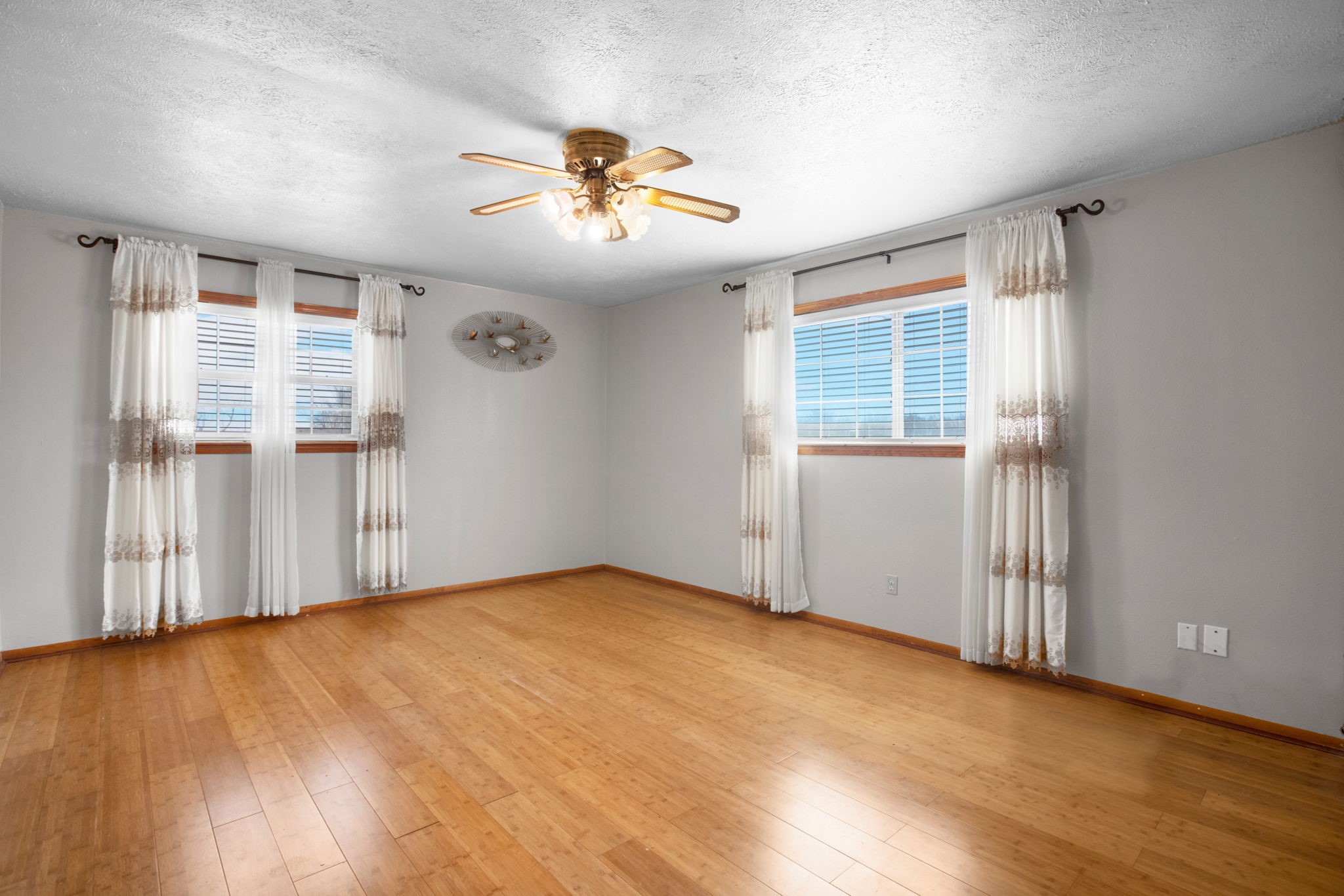 14205 Bohemian Hall Road Crosby, TX 77532 - Photo 12 of 33 a view of an empty room with wooden floor and a window