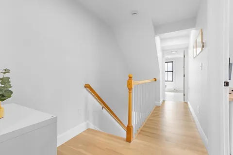 a bedroom with a bed and a chair