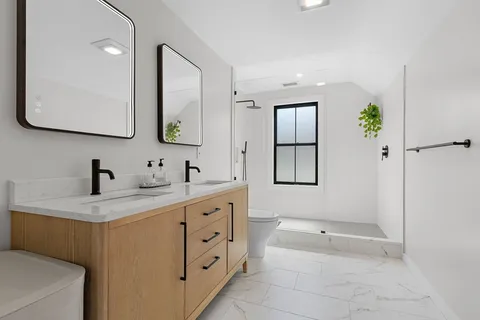 a bedroom with a washer and dryer