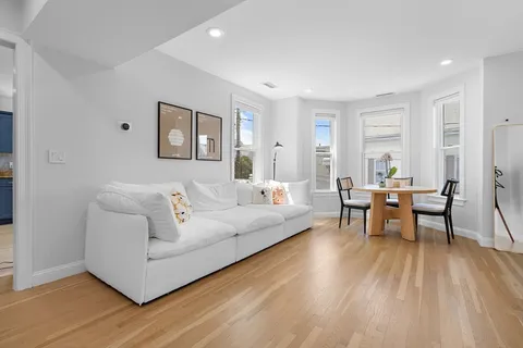 a kitchen with stainless steel appliances granite countertop a stove top oven a sink dishwasher and a refrigerator