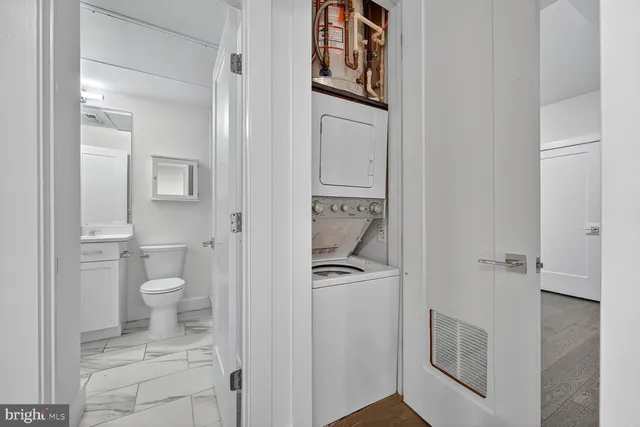 a bathroom with a toilet sink and shower