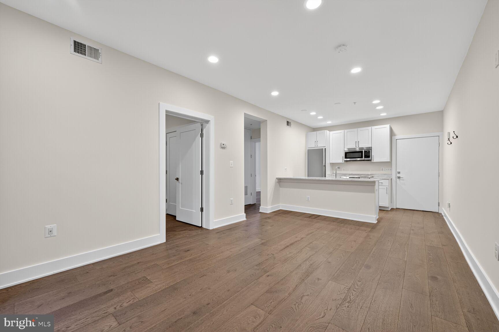 1412 Chapin Street Northwest, Unit 2 Washington, DC 20009 - Photo 5 of 15 a view of kitchen with wooden floor