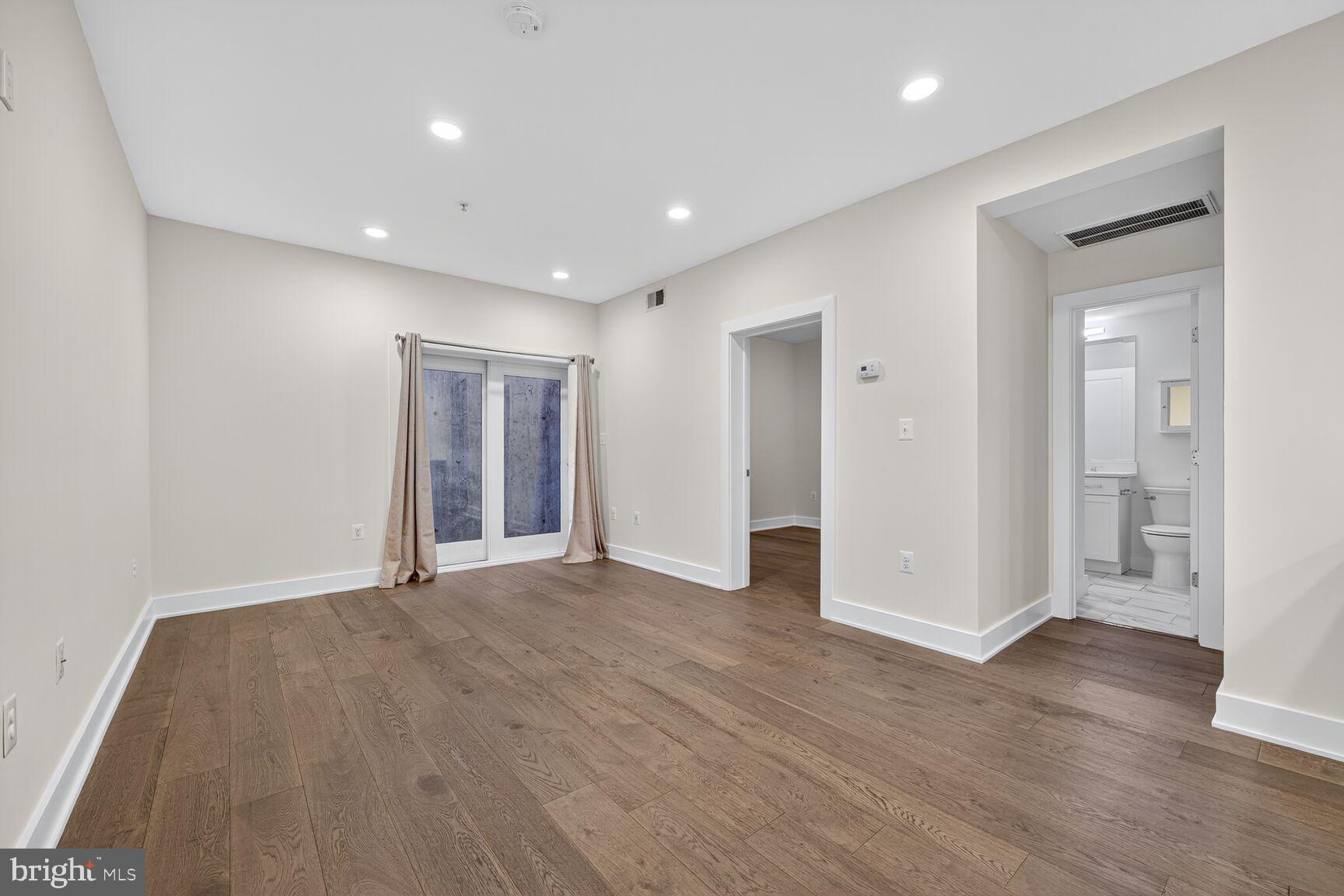 1412 Chapin Street Northwest, Unit 2 Washington, DC 20009 - Photo 7 of 15 a view of empty room with wooden floor
