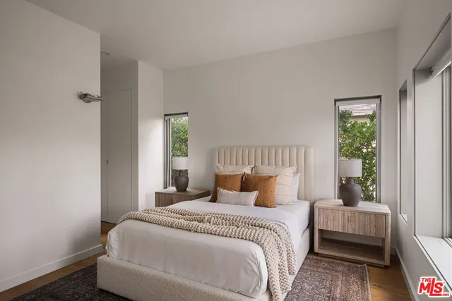 a bedroom with a bed and window