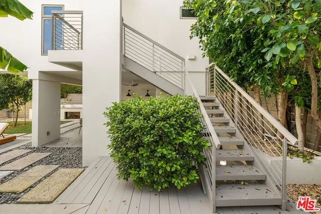 a view of a garden with wooden stairs